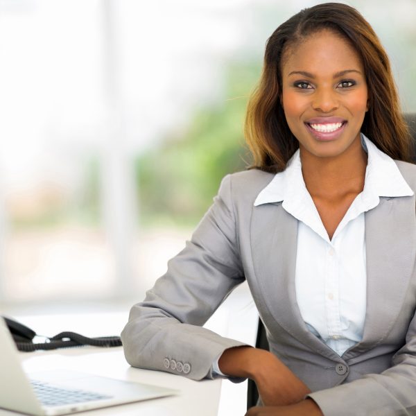 beautiful young afro american businesswoman sitting in office